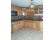 Kitchen with wood cabinets and granite counters at 3023 W Green St, Tampa, FL 33607