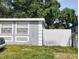 House exterior with gray siding and white fence at 3023 W Green St, Tampa, FL 33607