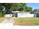House exterior, front view, small yard at 3023 W Green St, Tampa, FL 33607
