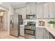 Kitchen with stainless steel appliances and gray cabinets at 16119 Culpepper Dr, Bradenton, FL 34211