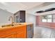 Kitchen with double sink, dishwasher, and wood cabinets at 2443 Waterfall Dr, Spring Hill, FL 34608