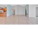 Bright living room with vaulted ceilings and tile flooring at 2443 Waterfall Dr, Spring Hill, FL 34608