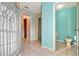 Bathroom with toilet and shower, and teal colored walls at 2443 Waterfall Dr, Spring Hill, FL 34608