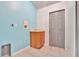 Laundry area with light blue walls and cabinets at 2443 Waterfall Dr, Spring Hill, FL 34608