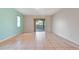 Bright living room with tile floors and sliding glass doors leading to the backyard at 2443 Waterfall Dr, Spring Hill, FL 34608