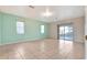 Living room with sliding doors to patio and tile floors at 2443 Waterfall Dr, Spring Hill, FL 34608