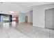 Open and airy living room with tile flooring and high ceilings at 2443 Waterfall Dr, Spring Hill, FL 34608