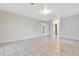 Spacious bedroom with tile floors and access to other rooms at 2443 Waterfall Dr, Spring Hill, FL 34608