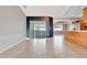 Living area featuring tile floors and sliding doors to backyard at 2443 Waterfall Dr, Spring Hill, FL 34608