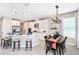 Modern kitchen with white cabinets, stainless steel appliances, and an island at 16123 Culpepper Dr, Bradenton, FL 34211