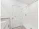 Well-lit bathroom features a walk-in shower and granite countertop vanity at 14044 Crutchfield Ct, Parrish, FL 34219