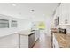 Bright kitchen featuring stainless steel appliances, granite countertops, and an open concept design at 14044 Crutchfield Ct, Parrish, FL 34219