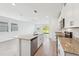 Bright kitchen featuring stainless steel appliances, granite countertops, and an open concept design at 14044 Crutchfield Ct, Parrish, FL 34219