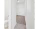 Spacious walk-in closet with shelving and neutral carpet flooring at 14044 Crutchfield Ct, Parrish, FL 34219