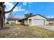 Ranch-style home with stone accents and a two-car garage at 7183 Lexington Cir, Brooksville, FL 34602