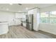 Modern kitchen with stainless steel appliances and white shaker cabinets at 1845 Skyland Dr, Clearwater, FL 33759