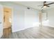 Large bedroom with private bathroom access and hardwood floors at 1845 Skyland Dr, Clearwater, FL 33759