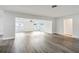 Open living room with wood-look floors and lots of light at 1845 Skyland Dr, Clearwater, FL 33759
