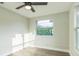 Bright bedroom with hardwood floors and a large window at 1845 Skyland Dr, Clearwater, FL 33759