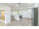 Open concept kitchen with island and stainless steel appliances at 1845 Skyland Dr, Clearwater, FL 33759