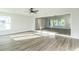 Bright living room with hardwood floors and large windows at 1845 Skyland Dr, Clearwater, FL 33759