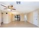 Bright living room with tile floors and ceiling fan at 7619 Summertree Ln, New Port Richey, FL 34653