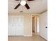 Spacious bedroom with double closets and ceiling fan at 7619 Summertree Ln, New Port Richey, FL 34653