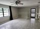 Living room with tiled floor and French doors at 7116 Flounder Dr, Tampa, FL 33617