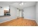 Open concept living room with hardwood floors, kitchen bar, and entryway at 1810 E Palm Ave # 1205, Tampa, FL 33605