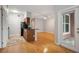 Combined living and kitchen area with wood floors and access to a patio at 1810 E Palm Ave # 1205, Tampa, FL 33605