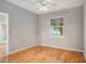 Bright bedroom with hardwood floors and a window with blinds at 1810 E Palm Ave # 1205, Tampa, FL 33605