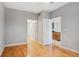 Spacious bedroom with hardwood floors and access to other rooms at 1810 E Palm Ave # 1205, Tampa, FL 33605