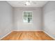 Simple bedroom with hardwood floors and a window at 1810 E Palm Ave # 1205, Tampa, FL 33605