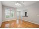 Living room with hardwood floors, large window, and kitchen bar at 1810 E Palm Ave # 1205, Tampa, FL 33605