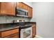 Modern kitchen with stainless steel appliances and granite countertops at 1810 E Palm Ave # 1205, Tampa, FL 33605