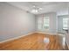 Bright living room with hardwood floors, ceiling fan, and large windows at 1810 E Palm Ave # 1205, Tampa, FL 33605