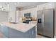 Modern kitchen with stainless steel appliances and an island at 3327 Trapper Ln, North Port, FL 34286