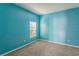 Spacious bedroom with light blue walls and a window with blinds at 612 Marion Hill Ln, Ruskin, FL 33570