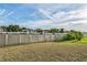Large backyard with a fence and green grass at 612 Marion Hill Ln, Ruskin, FL 33570