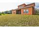 Two-story house with a large backyard and a covered patio at 612 Marion Hill Ln, Ruskin, FL 33570