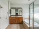 Main bathroom with a double vanity, garden tub, and walk-in shower at 612 Marion Hill Ln, Ruskin, FL 33570