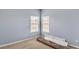 Well-lit bedroom with two windows and neutral walls at 612 Marion Hill Ln, Ruskin, FL 33570