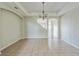 Elegant dining room featuring tile flooring and a decorative chandelier at 612 Marion Hill Ln, Ruskin, FL 33570