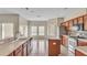 Kitchen with island, stainless steel appliances, and wood cabinets at 612 Marion Hill Ln, Ruskin, FL 33570
