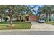 Single-Gathering home with a peach-colored exterior and a two-car garage at 612 Marion Hill Ln, Ruskin, FL 33570
