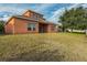 Two-story house with a large backyard and a covered patio at 612 Marion Hill Ln, Ruskin, FL 33570