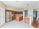 Kitchen with an island, stainless steel appliances, and wood cabinets at 612 Marion Hill Ln, Ruskin, FL 33570