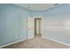 Simple bedroom with light blue walls and carpet at 612 Marion Hill Ln, Ruskin, FL 33570