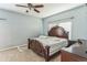 Primary bedroom with a large bed and ceiling fan at 612 Marion Hill Ln, Ruskin, FL 33570