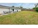 Large backyard with patio, grassy area, and grill at 3310 W 63Rd W St, Bradenton, FL 34209